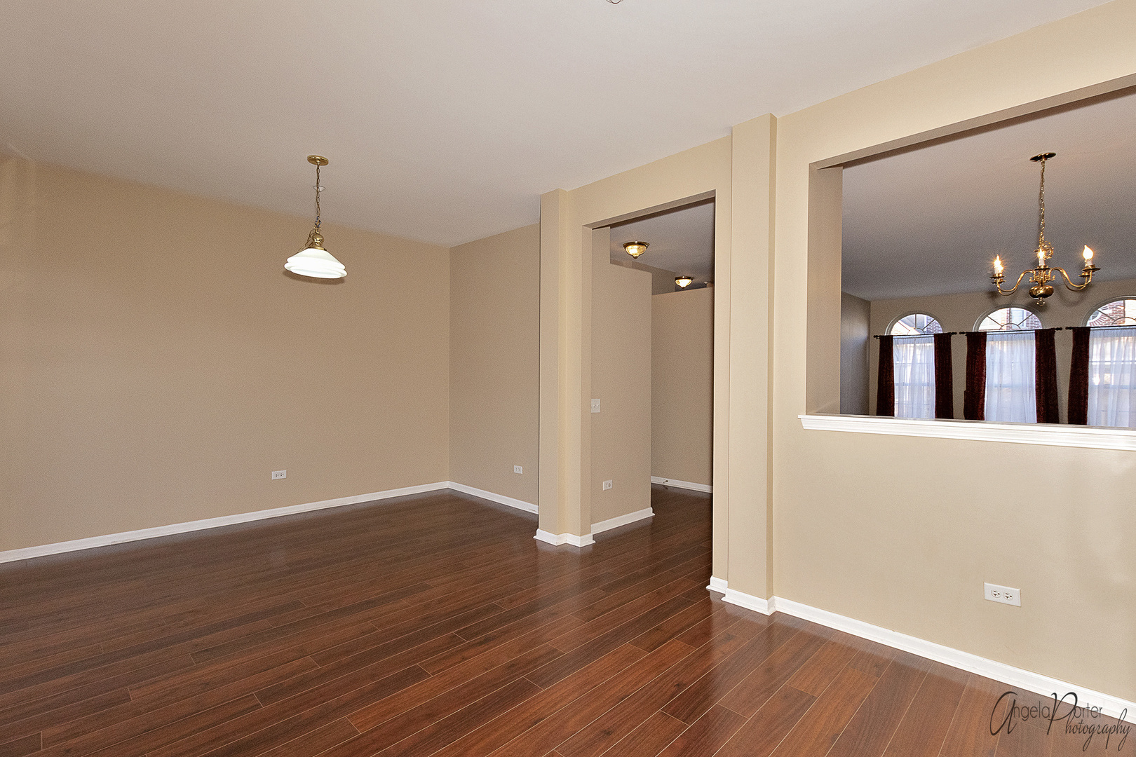 707 Prestwick Lane Wheeling, IL 60090 - Photo 12 of 29 a view of a room with wooden floor and chandelier