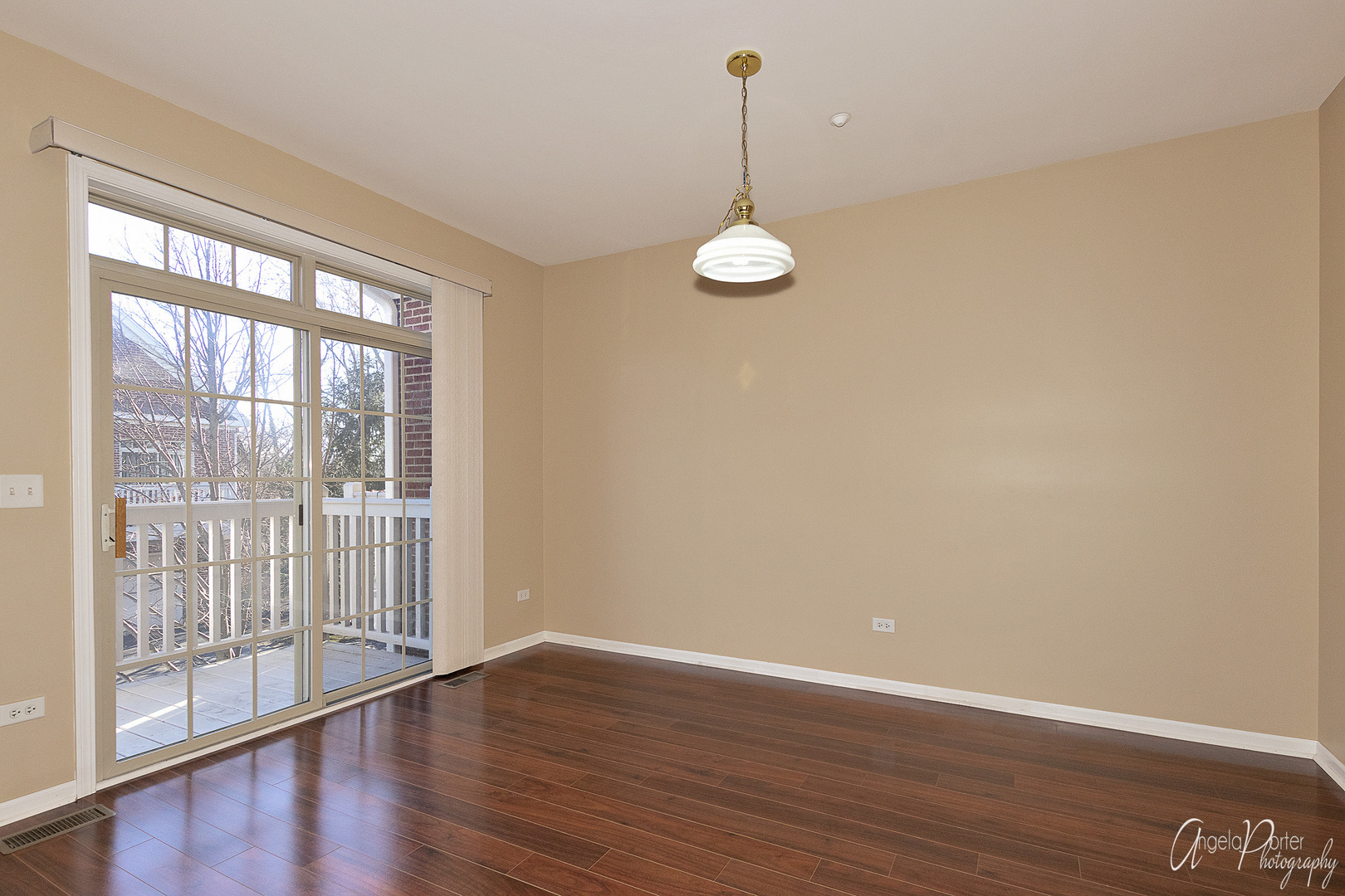 707 Prestwick Lane Wheeling, IL 60090 - Photo 13 of 29 a view of empty room with wooden floor and large window