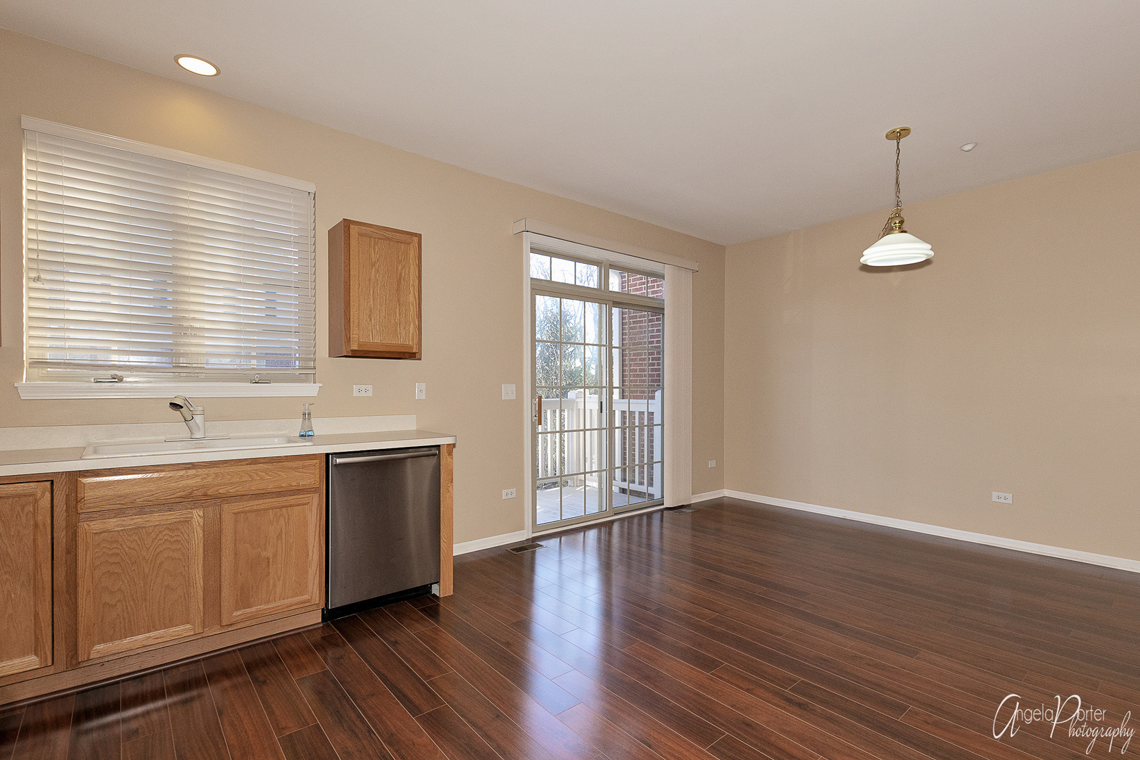 707 Prestwick Lane Wheeling, IL 60090 - Photo 14 of 29 a view of an empty room with window and wooden floor