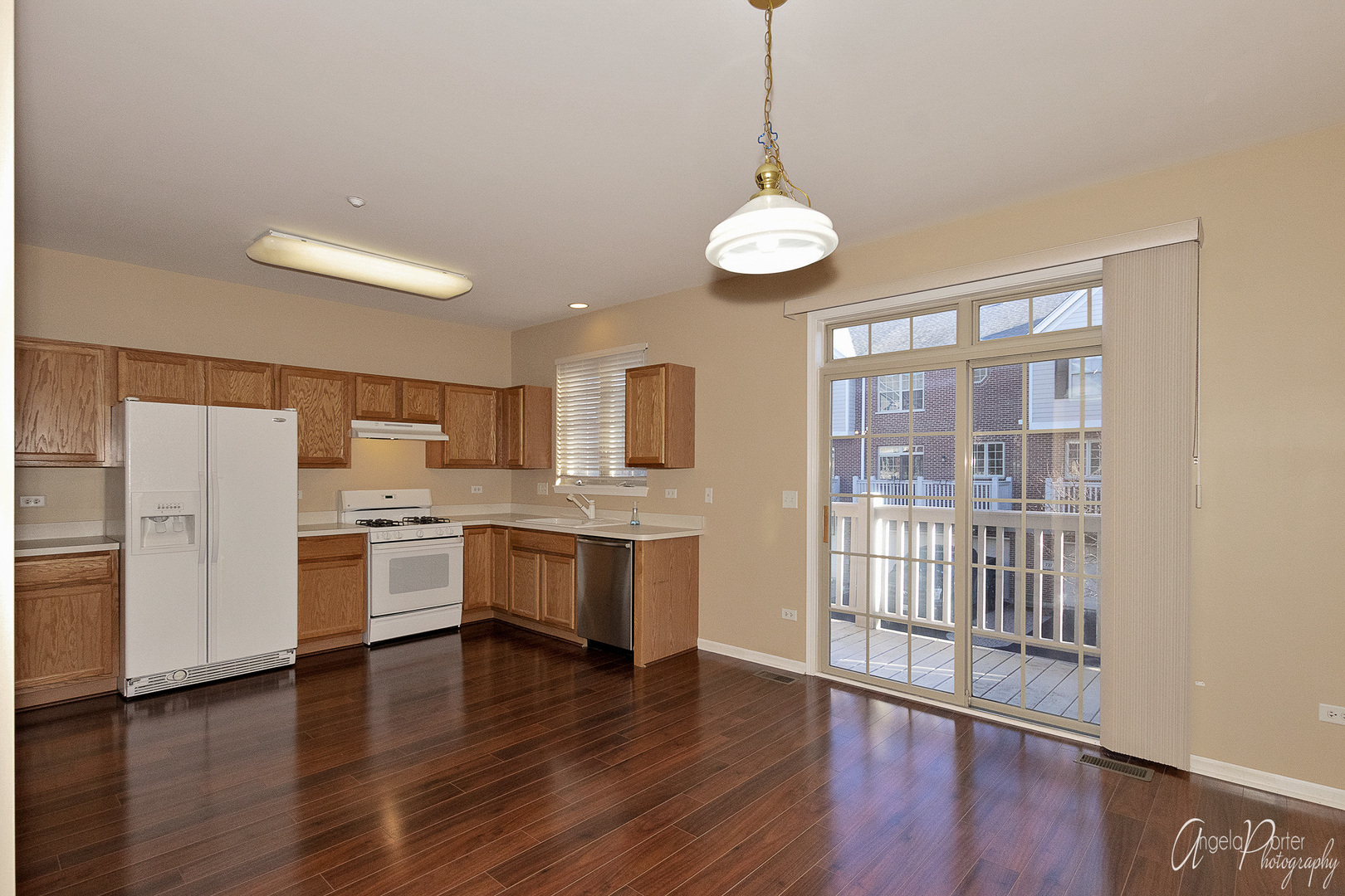 707 Prestwick Lane Wheeling, IL 60090 - Photo 15 of 29 a large kitchen with a large window and stainless steel appliances