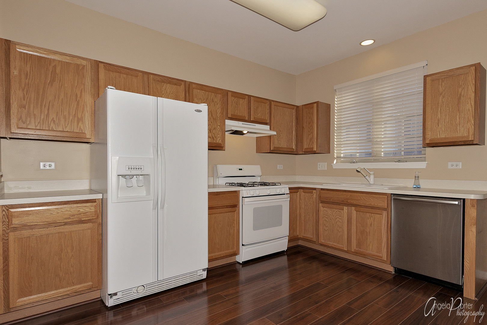 707 Prestwick Lane Wheeling, IL 60090 - Photo 17 of 29 a kitchen with granite countertop cabinets and white stainless steel appliances