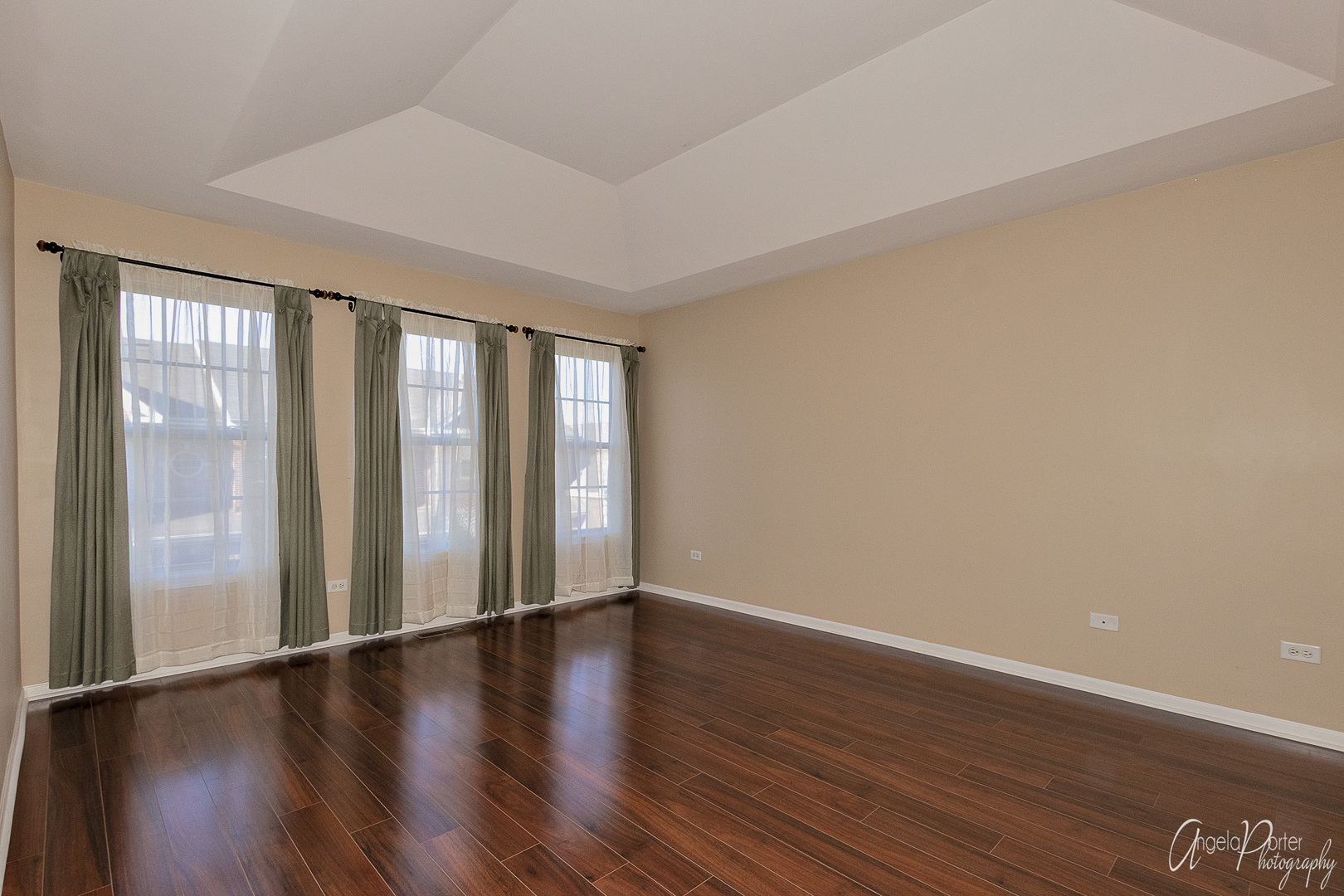 707 Prestwick Lane Wheeling, IL 60090 - Photo 3 of 29 a view of an empty room with wooden floor and a window