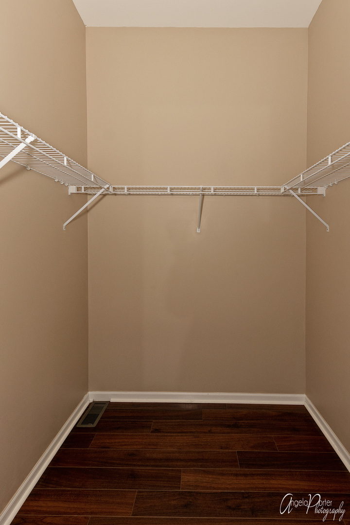 707 Prestwick Lane Wheeling, IL 60090 - Photo 21 of 29 a view of a room with racks on the wall