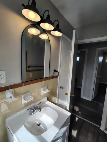 a bathroom with a sink and a mirror