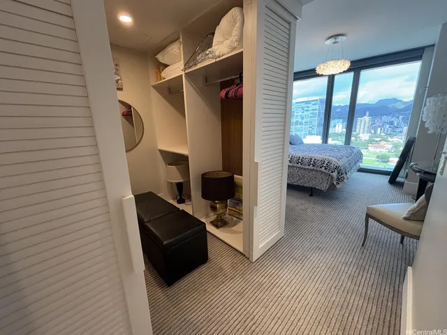 a bedroom with a bed and a couch