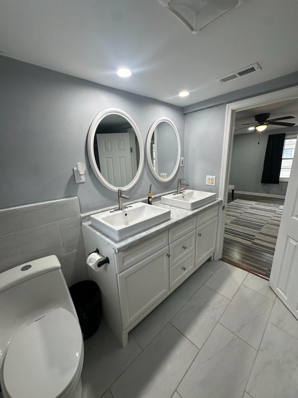 108 Bell Street Dover, DE 19901 - Photo 8 of 16 Sleek dual vanity sinks in bathroom.