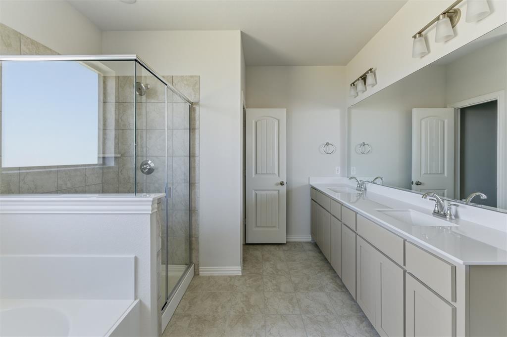1221 Sabine River Lane Springtown, TX 76082 - Photo 17 of 25 Full bathroom with double vanity, a bath, and a stall shower