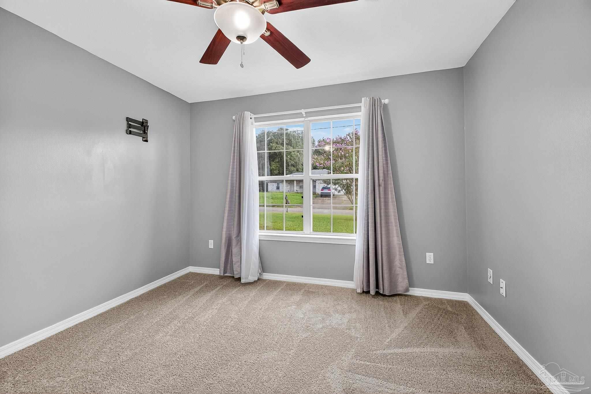 5053 Copperfield Drive Pace, FL 32571 - Photo 12 of 52 an empty room with windows