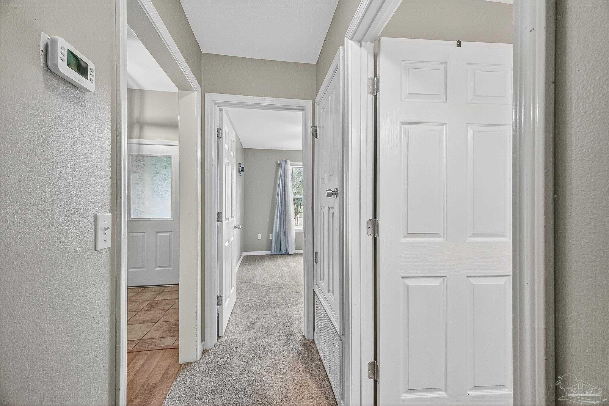 5053 Copperfield Drive Pace, FL 32571 - Photo 19 of 52 view of a hallway with wooden floor and closet area