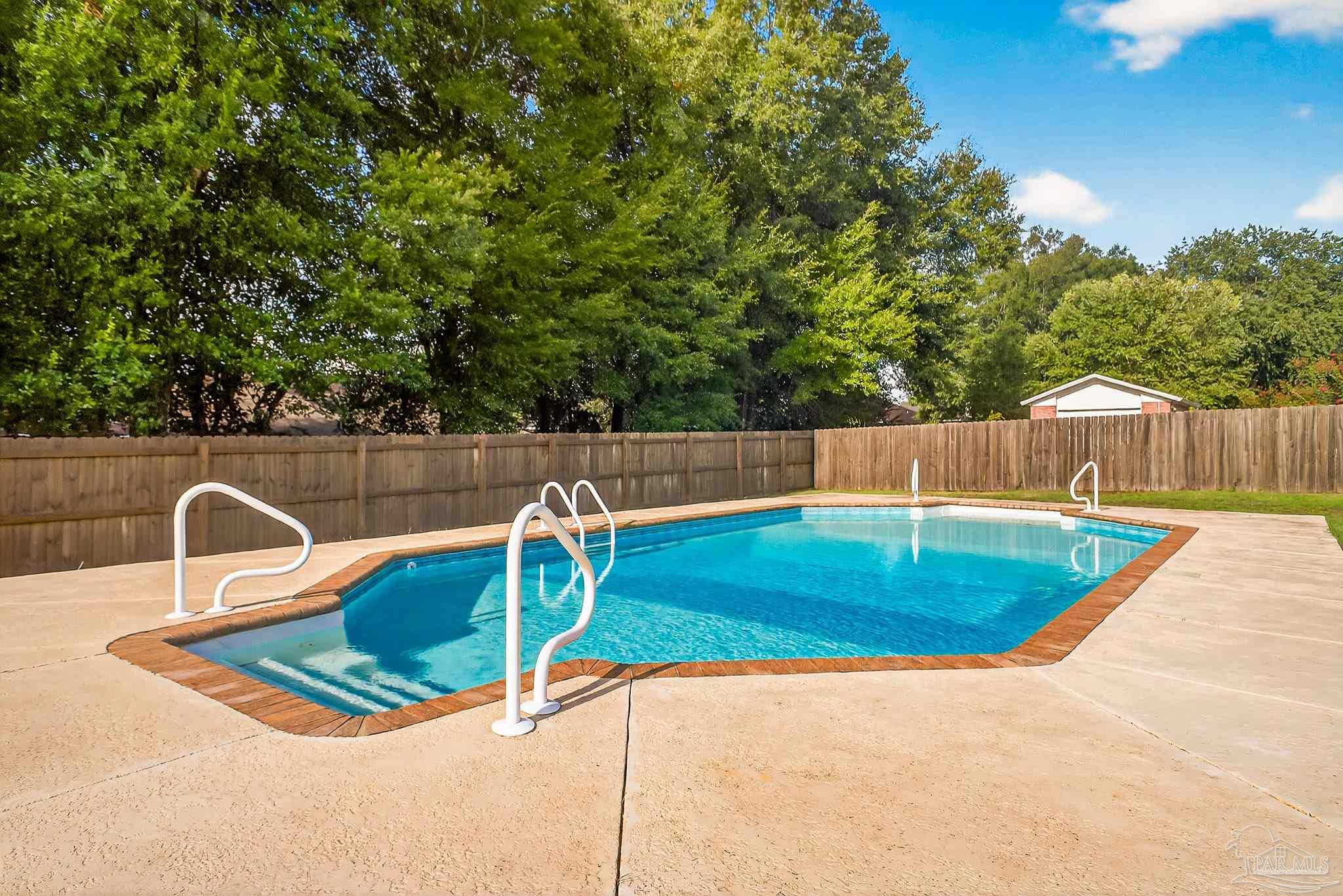 5053 Copperfield Drive Pace, FL 32571 - Photo 2 of 52 a view of a backyard with swimming pool