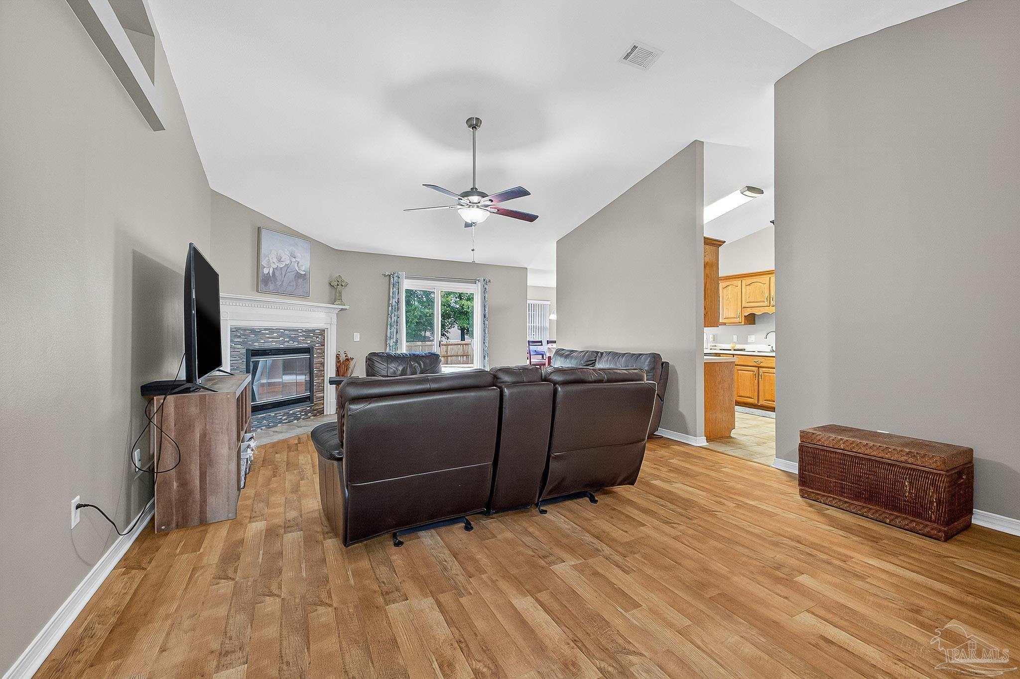 5053 Copperfield Drive Pace, FL 32571 - Photo 21 of 52 a living room with furniture and a flat screen tv