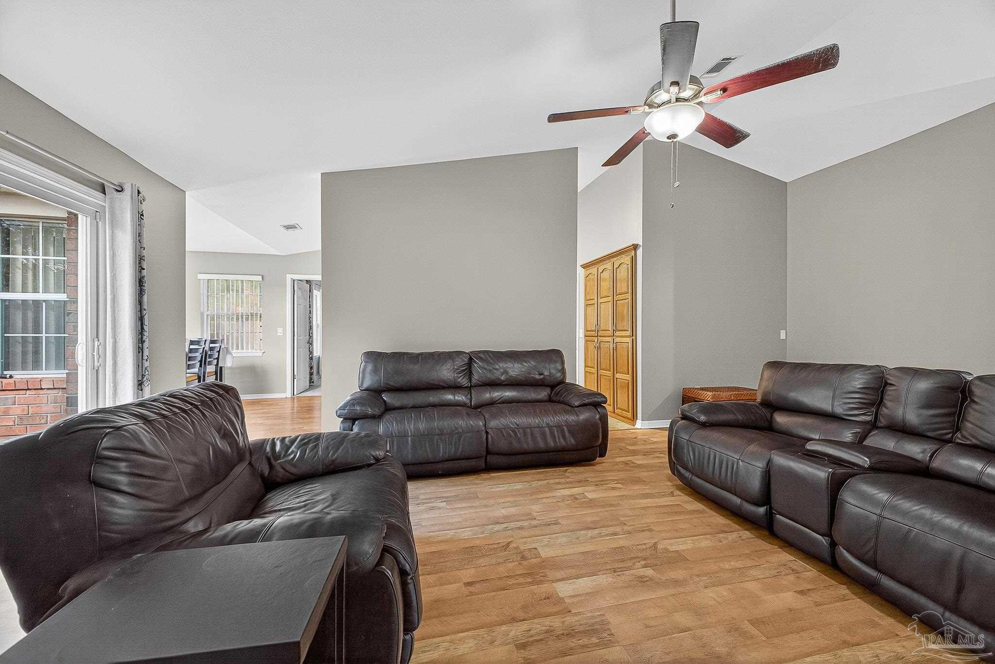 5053 Copperfield Drive Pace, FL 32571 - Photo 24 of 52 a living room with furniture and a window