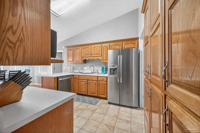 a kitchen with a sink and a stove