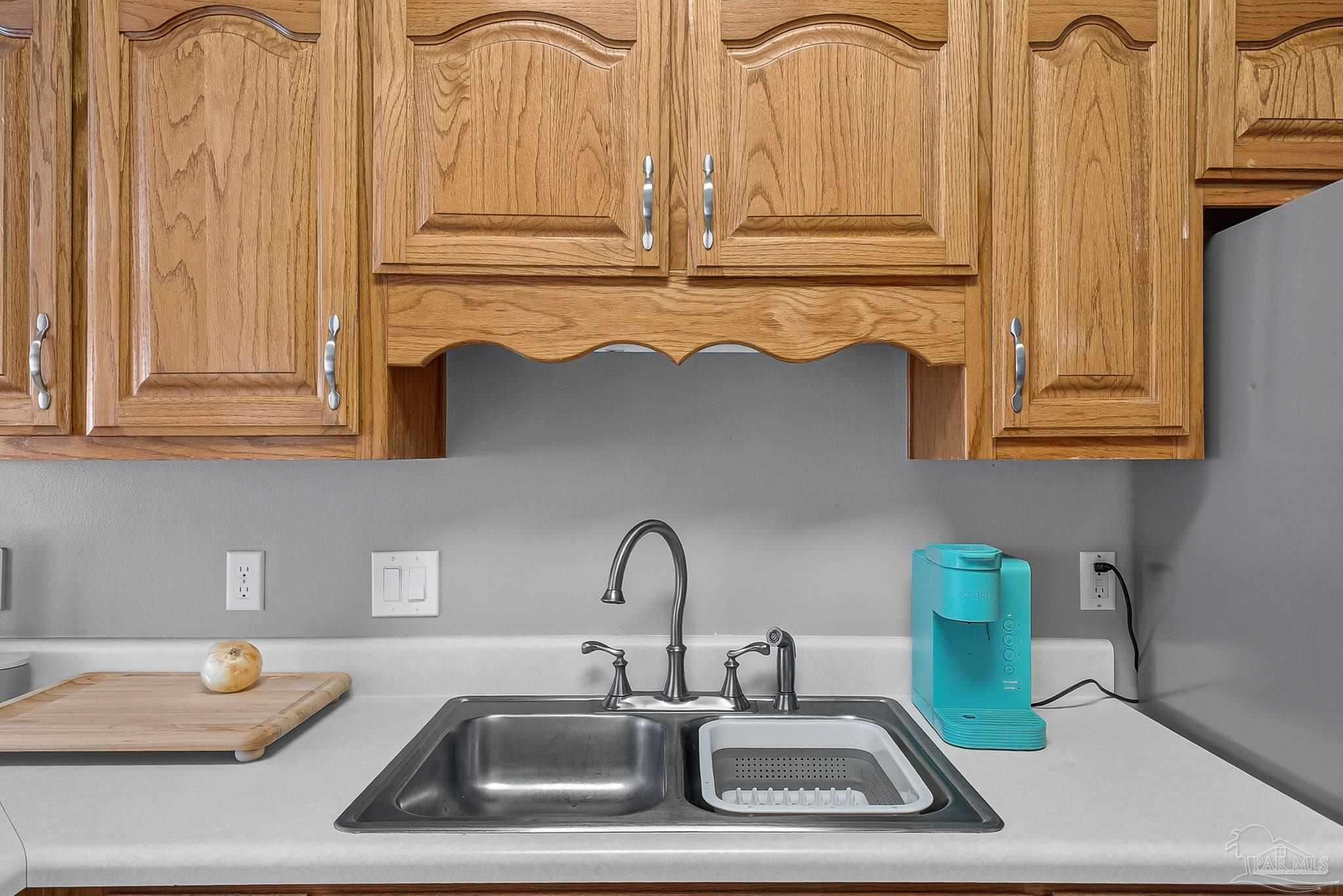 5053 Copperfield Drive Pace, FL 32571 - Photo 26 of 52 a kitchen with a sink and a stove