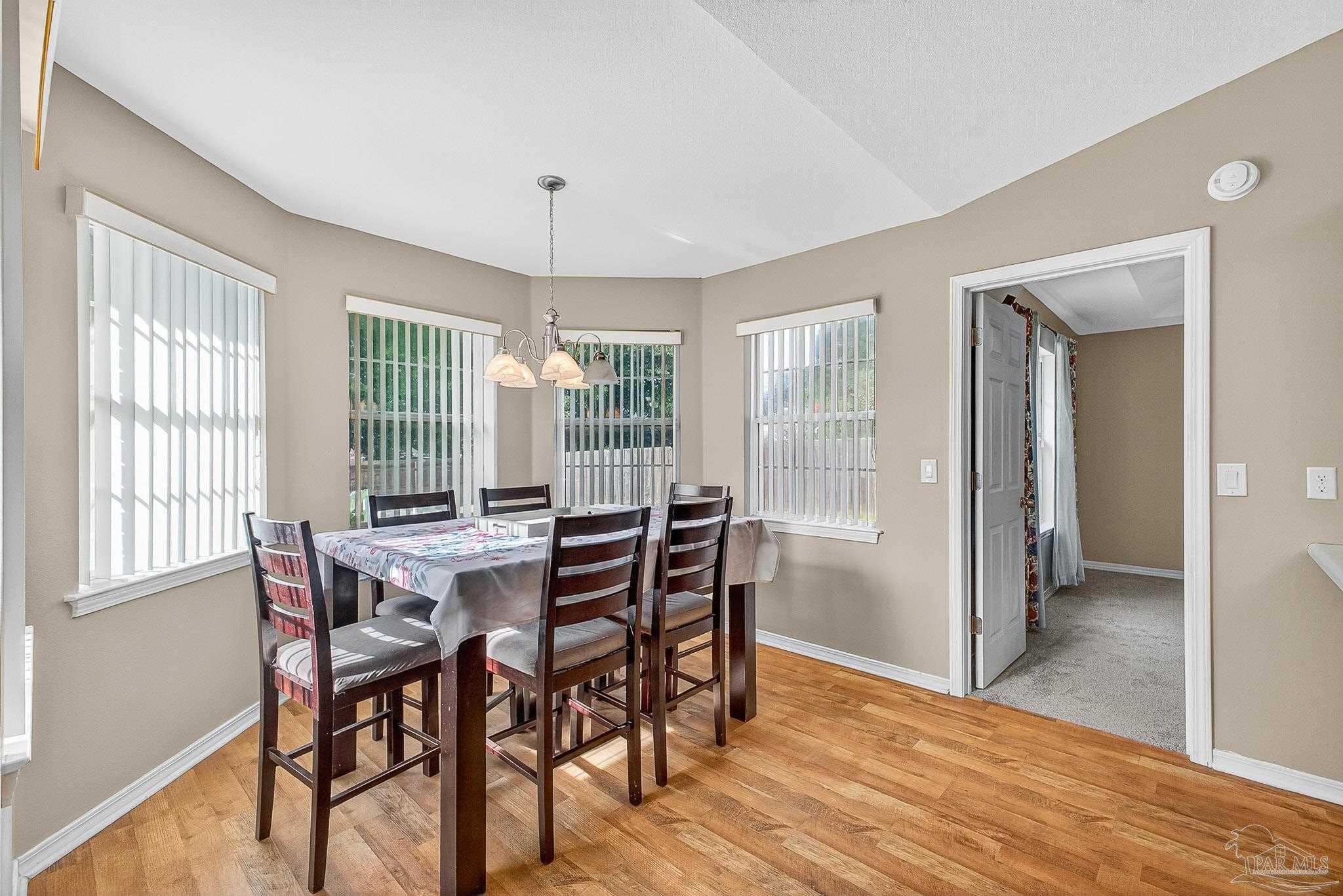 5053 Copperfield Drive Pace, FL 32571 - Photo 32 of 52 a view of a dining room with furniture and window