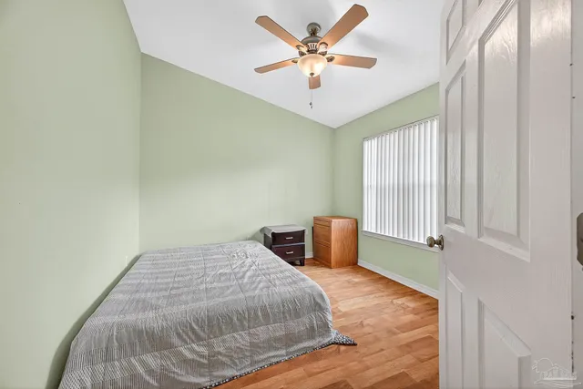 a bedroom with a bed and a cabinets