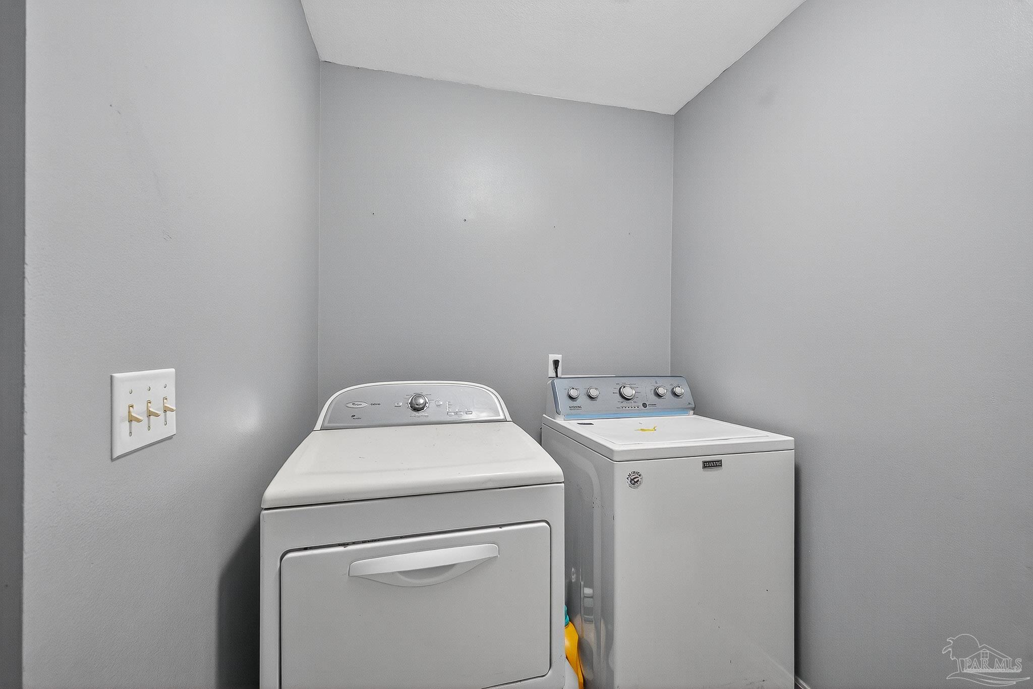 5053 Copperfield Drive Pace, FL 32571 - Photo 43 of 52 a utility room with dryer and washer