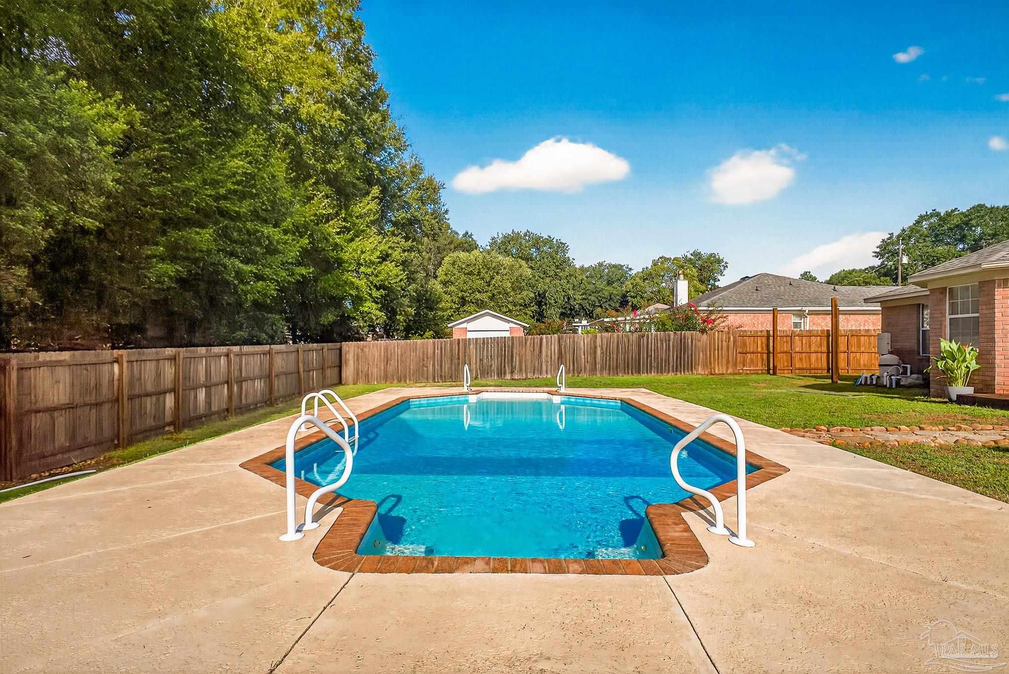 5053 Copperfield Drive Pace, FL 32571 - Photo 45 of 52 a view of a backyard with swimming pool