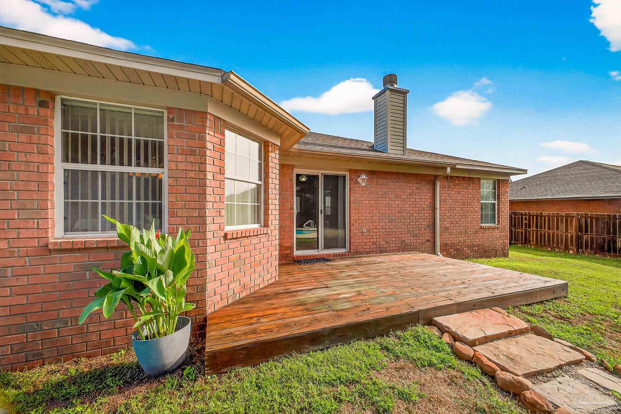 5053 Copperfield Drive Pace, FL 32571 - Photo 50 of 52 a front view of a house with a yard