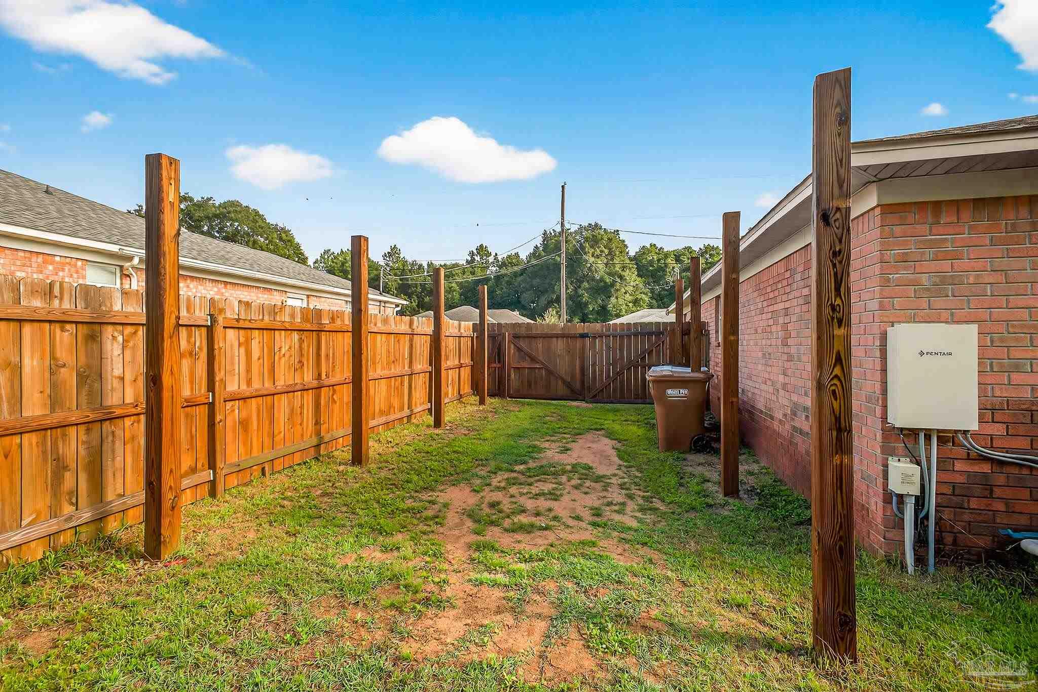 5053 Copperfield Drive Pace, FL 32571 - Photo 51 of 52 a view of a backyard of the house