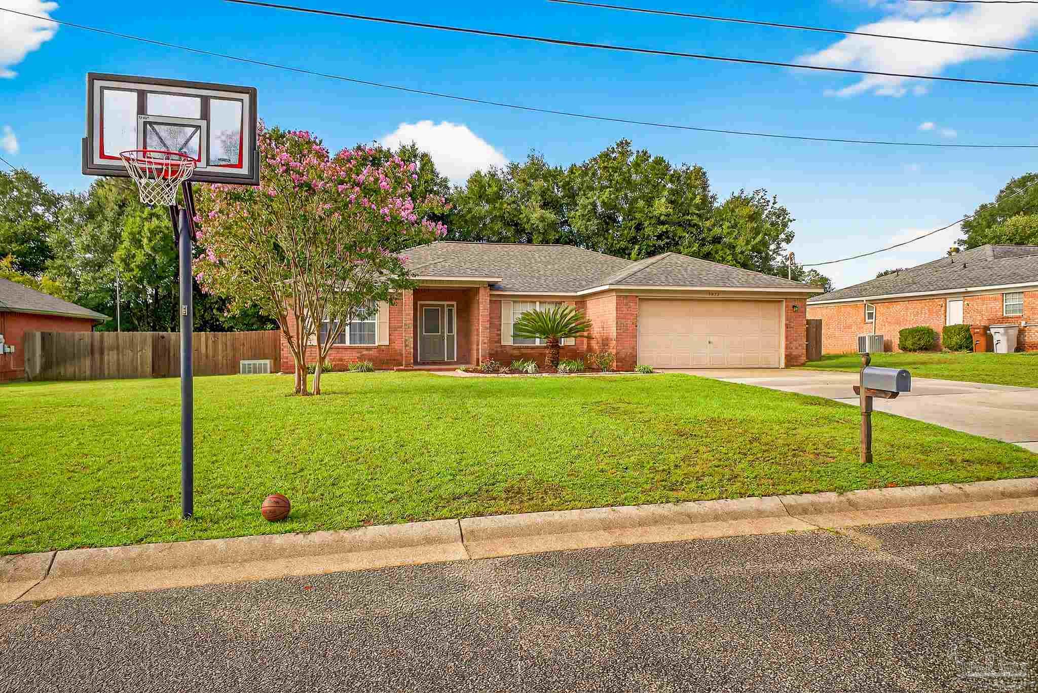 5053 Copperfield Drive Pace, FL 32571 - Photo 52 of 52 a front view of house with yard and green space