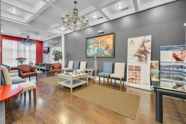 a kitchen with stainless steel appliances granite countertop a refrigerator and a counter space