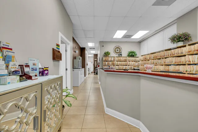 a kitchen with stainless steel appliances granite countertop a sink and a white cabinets
