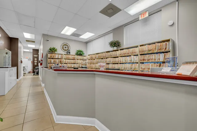 a kitchen with stainless steel appliances kitchen island granite countertop a sink and cabinets