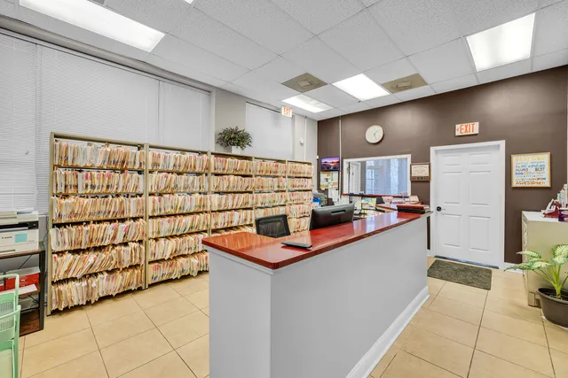 a view of a kitchen with a sink and cabinets