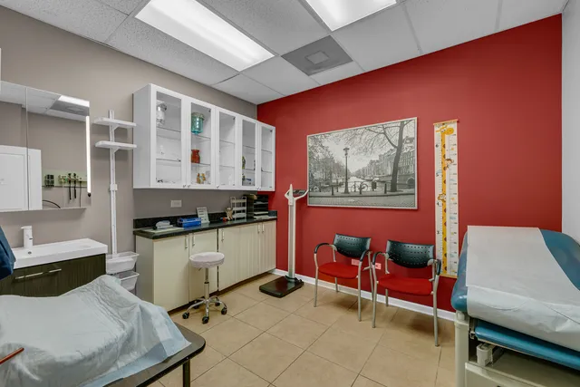 a room with furniture and wall paintings