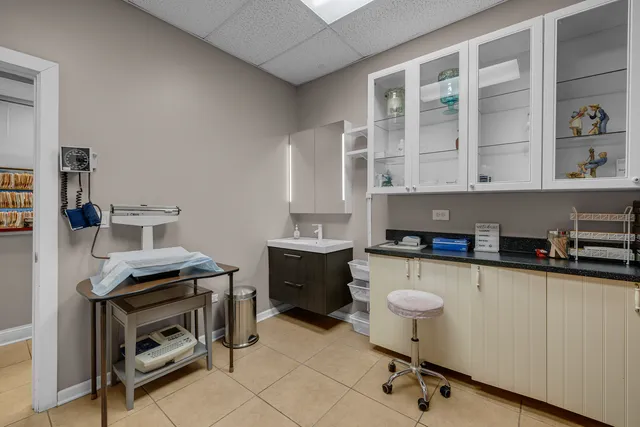 a work room with furniture and book shelf
