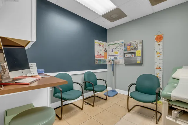 a view of a workspace with furniture