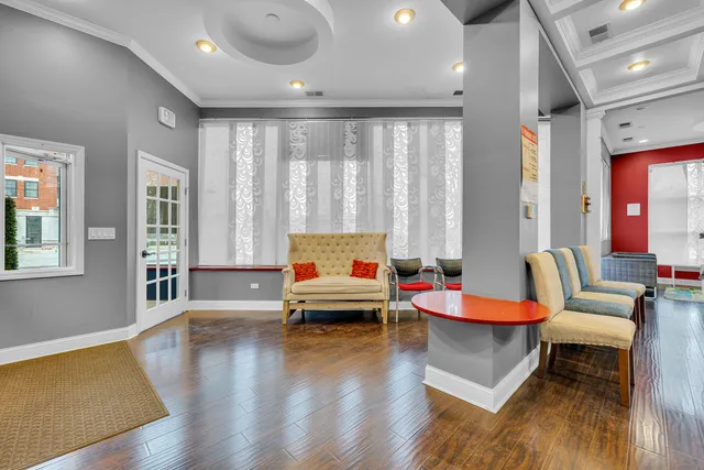 a view of a living room and chandelier