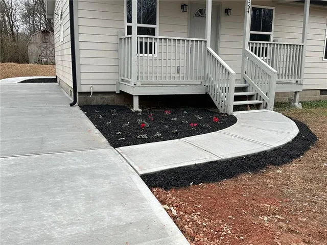 a view of balcony with wooden floor and fence