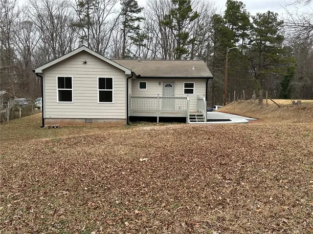 a house with trees in the background