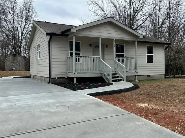 a front view of a house with garage