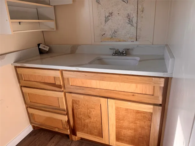 a bathroom with a sink and a mirror