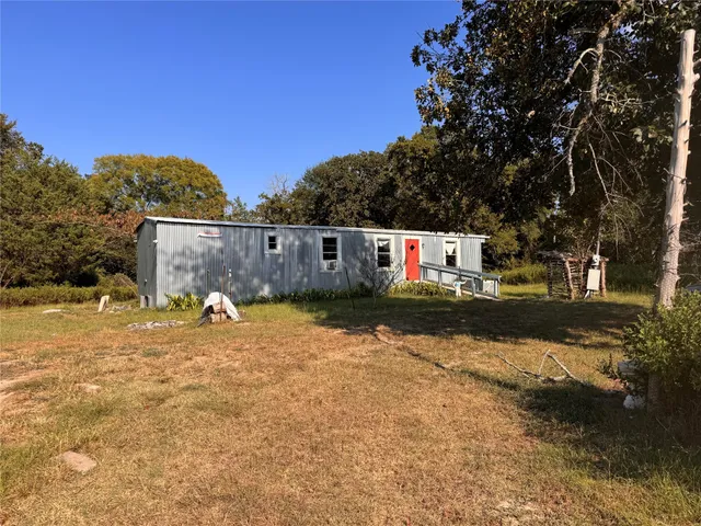 a view of backyard of a house