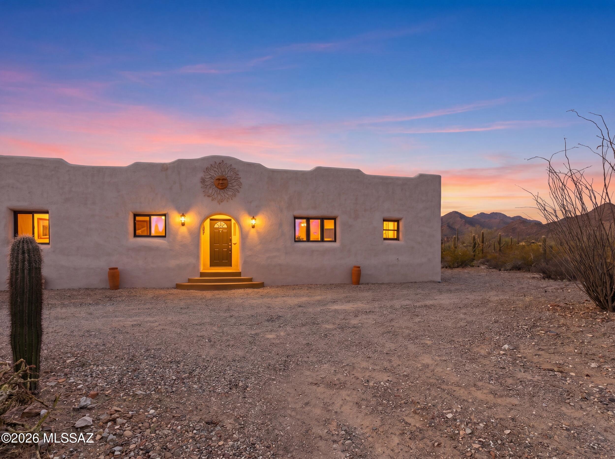 10855 West Mile Wide Road Tucson, AZ 85743 - Photo 2 of 47 Front of Home Sunset