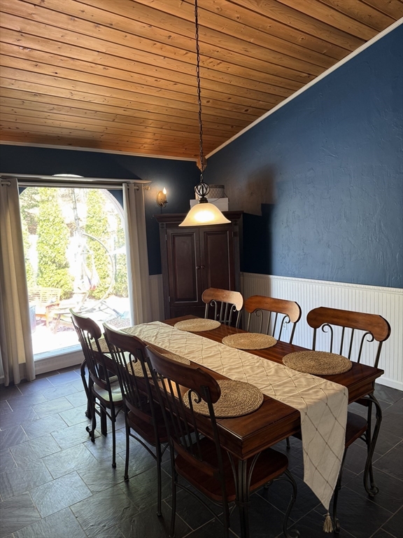 1511 Dunhamtown Brimfield Road Brimfield, MA 01010 - Photo 11 of 36 a dining room with a wooden table and chairs