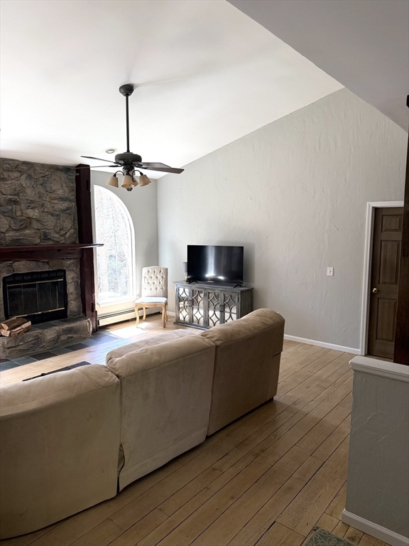 1511 Dunhamtown Brimfield Road Brimfield, MA 01010 - Photo 15 of 36 a living room with furniture and a fireplace
