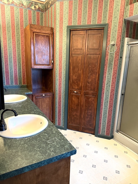 1511 Dunhamtown Brimfield Road Brimfield, MA 01010 - Photo 17 of 36 a bathroom with a granite countertop sink and a mirror