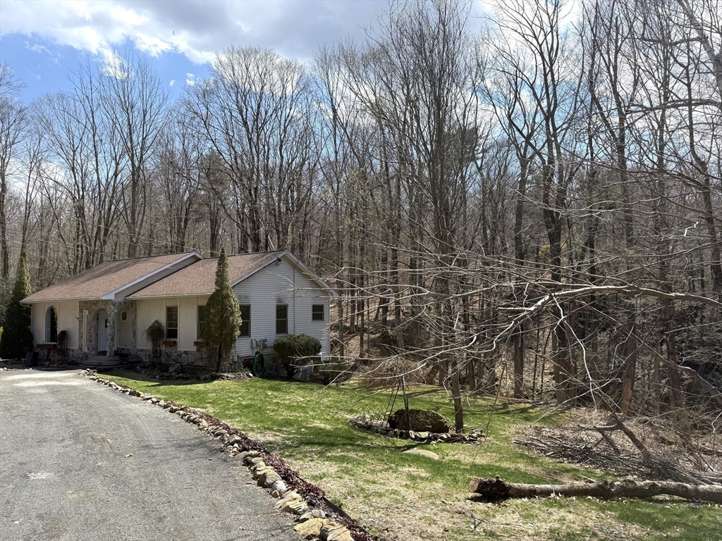 1511 Dunhamtown Brimfield Road Brimfield, MA 01010 - Photo 2 of 36 a front view of a house with a yard