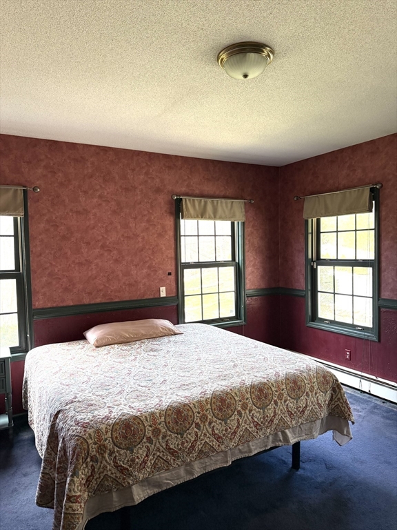 1511 Dunhamtown Brimfield Road Brimfield, MA 01010 - Photo 26 of 36 a bedroom with a bed and window