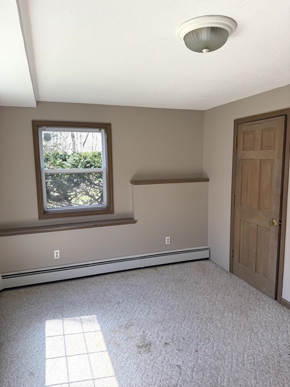 1511 Dunhamtown Brimfield Road Brimfield, MA 01010 - Photo 35 of 36 an empty room with windows