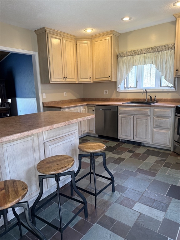 1511 Dunhamtown Brimfield Road Brimfield, MA 01010 - Photo 5 of 36 a kitchen with a stove a sink cabinets and wooden floor