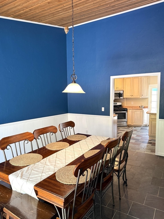 1511 Dunhamtown Brimfield Road Brimfield, MA 01010 - Photo 10 of 36 a view of a dining room with furniture and chandelier