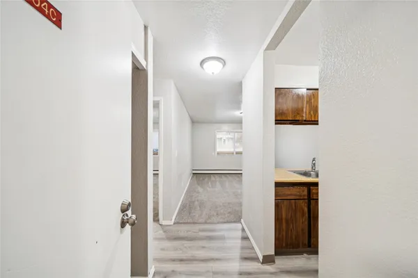 a kitchen with a sink and refrigerator