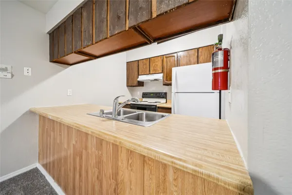 a close view of sink and cabinets