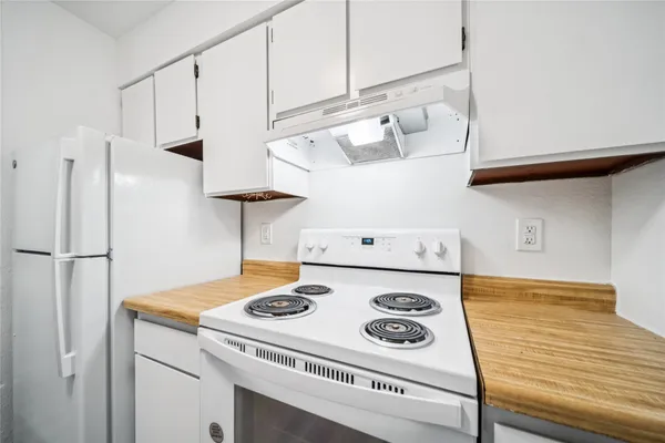 a close view of sink and cabinets